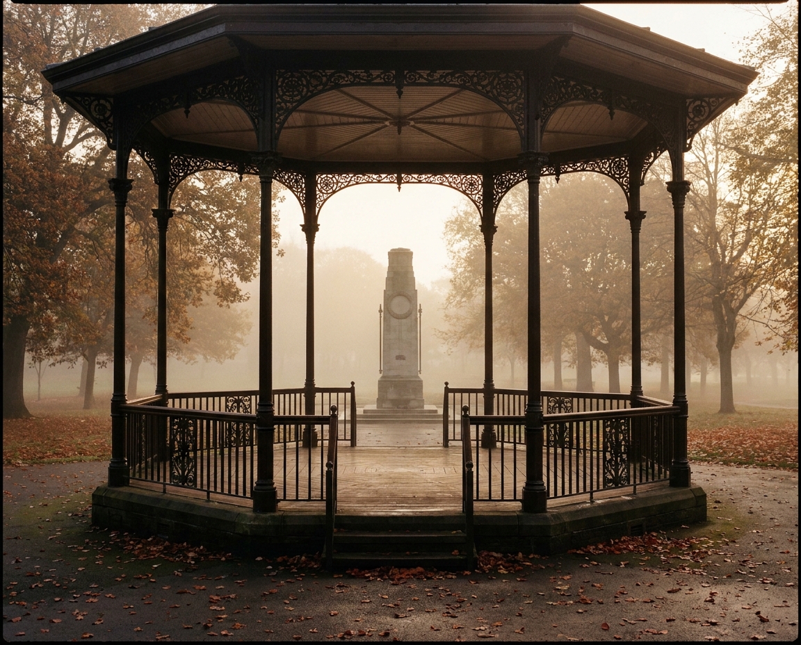 A wide soft-light view of the bandstand and Cenotaph in Greenhead Park on a still autumn morning